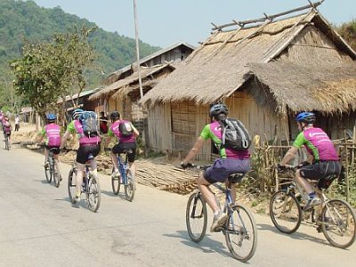cycling past village